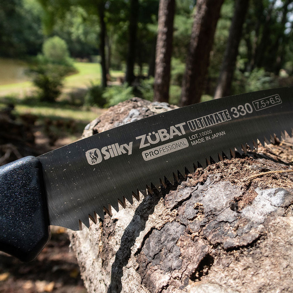 Shop the Silky Saw Zubat Ultimate Professional Hand Saw at Mower City Albury. It features a 13" curved blade, a comfortable rubber handle, and an improved design for efficient cutting. Perfect for professional arborists, order now! in action